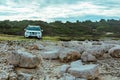 white suv between rocks. off road car travel concept Royalty Free Stock Photo