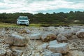 white suv between rocks. off road car travel concept Royalty Free Stock Photo