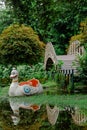 The white swan or duck pedal boat is moored in a lake in the park. Royalty Free Stock Photo