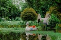 The white swan or duck pedal boat is moored in a lake in the park. Royalty Free Stock Photo