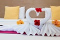 White swans made from towels on bed Royalty Free Stock Photo