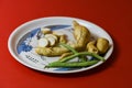 White sweet potato pieces slices protein food on red background