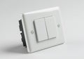 A white switch with two white buttons on it AI generated Royalty Free Stock Photo