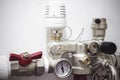 White switch and underfloor heating thermostat on a white concrete wall in the boiler room of a private house. Close-up of a Royalty Free Stock Photo