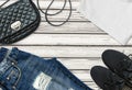 White t-shirt, blue boyfriend jeans, bag and black textile shoes Royalty Free Stock Photo