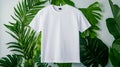 White t-shirt display on tropical green leaf background Royalty Free Stock Photo