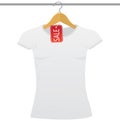 White t-shirt on a hanger with sale tag Royalty Free Stock Photo