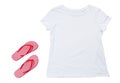 White t-shirt mock up and beach slippers isolated on white background. Tshirt empty copy space. Summer concept Royalty Free Stock Photo