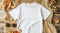 a white t-shirt mockup with a blank shirt template photo, featuring stylish fall accessories against a rustic burlap Royalty Free Stock Photo