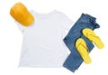 White t-shirt mockup top view isolated, yellow summer cap, blue denim jeans and flip flops Royalty Free Stock Photo
