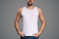 White t-shirt on a young man template. Gray background. Royalty Free Stock Photo