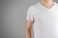 White t shirt on a young man template on gray. Isolated on grey Royalty Free Stock Photo