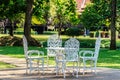 White Table and Alloy chairs in Garden Royalty Free Stock Photo