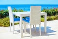 White table of a beach restaurant near the sea Royalty Free Stock Photo