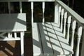 White table and bench on the summer veranda. Wooden furniture. Stylist of the 19th century.