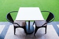 White table and black chair in coffee shop. Royalty Free Stock Photo