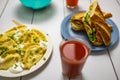 White table with black lines with dishes and drinks like salad dumplings