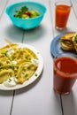 White table with black lines with dishes and drinks like salad dumplings