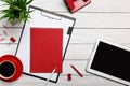 White table boards folder red notepad cup morning coffee clock paper clip workflow preparation Royalty Free Stock Photo