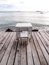 White table and chair on the beach 1 Royalty Free Stock Photo