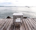 White table and chair on the beach 2 Royalty Free Stock Photo