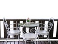 White table and chairs in garden. Royalty Free Stock Photo