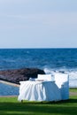 White table and chairs by the seaside