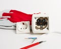 on a white table, a disassembled electrical outlet, ready to install, stripped wires and a red screwdriver with Royalty Free Stock Photo