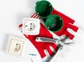 on a white table  a disassembled electrical outlet  ready to install  stripped wires and a red screwdriver with protective gloves Royalty Free Stock Photo