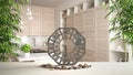 White table shelf with bagua, pebble stone and bamboo plants, modern white and wooden kitchen in contemporary apartment, zen Royalty Free Stock Photo