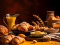 the table is set with many croissants, bread and butter