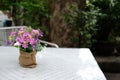 white table on terrace of house. wicker rattan chair on patio ne Royalty Free Stock Photo