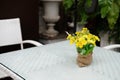 white table on terrace of house. wicker rattan chair on patio ne Royalty Free Stock Photo