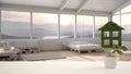 White table top or shelf with green plant in pot shaped like house, modern blurred pallet bedroom with panoramic window, interior