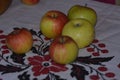 Red-green apples lie on the table