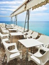 White tables in a cafe by the seaside