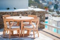 White tables with chairs at summer empty open air cafe in luxury hotel