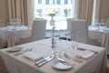 White tables with dinnerware