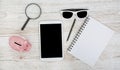 White Tablet With Blank Screen, laptop and accessories and office stuff On Wooden Desk With Stationary Objects , Top View,Travel c Royalty Free Stock Photo