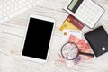 White Tablet With Blank Screen, laptop and accessories and office stuff On Wooden Desk With Stationary Objects , Top View,Travel c Royalty Free Stock Photo