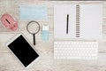 White Tablet With Blank Screen, laptop and accessories and office stuff On Wooden Desk With Stationary Objects , Top View,Travel c Royalty Free Stock Photo