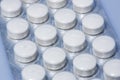 White tablets in packaging, closeup