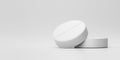 White tablets or painkillers with a pharmacy on a medical background. White pills for alleviating illness or fever. 3D rendering