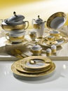 White tableware set with gold trim