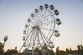 white tall ferris wheel in sight of a blue cloudless sky