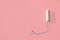 White tampon on pink background. Isolated on pink. Woman`s hygiene and health Royalty Free Stock Photo