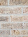 White, tan, and light red brick with light gray mortar up close