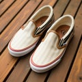 White And Tan Vans Slip Ons With Leather Stripes