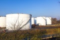 White tank in tank farm with blue Royalty Free Stock Photo