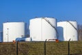 White tank in tank farm with blue Royalty Free Stock Photo